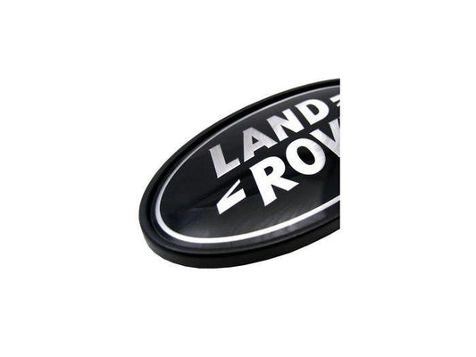 DAH500330 - SUPERCHARGED OVAL BADGE - BLACK  SILVER (FOR USE ON REAR OF VEHICLES) - GENUINE LAND ROVER